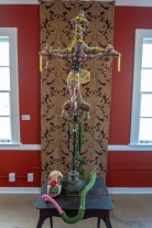 Anchorite's Crucifix 2018 Mixed media: repurposed fabric ,found objects, embroidery floss, vintage table, poly-fil 60 by 32 by 10 inches, excluding table